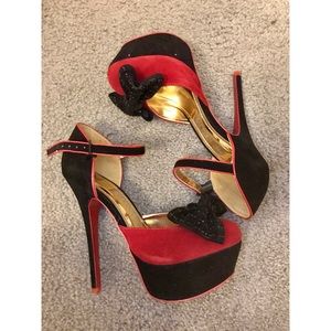 Black and red suede heels with jewel bow